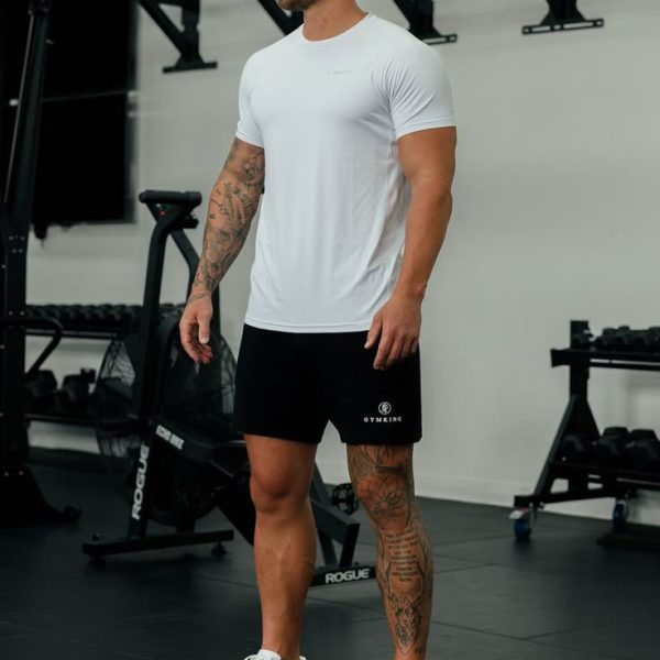 Gym Style in Unisex T Shirt from UPIKAS CREATION Man stretching in park wearing breathable gym-ready T shirt from Upikas Creation